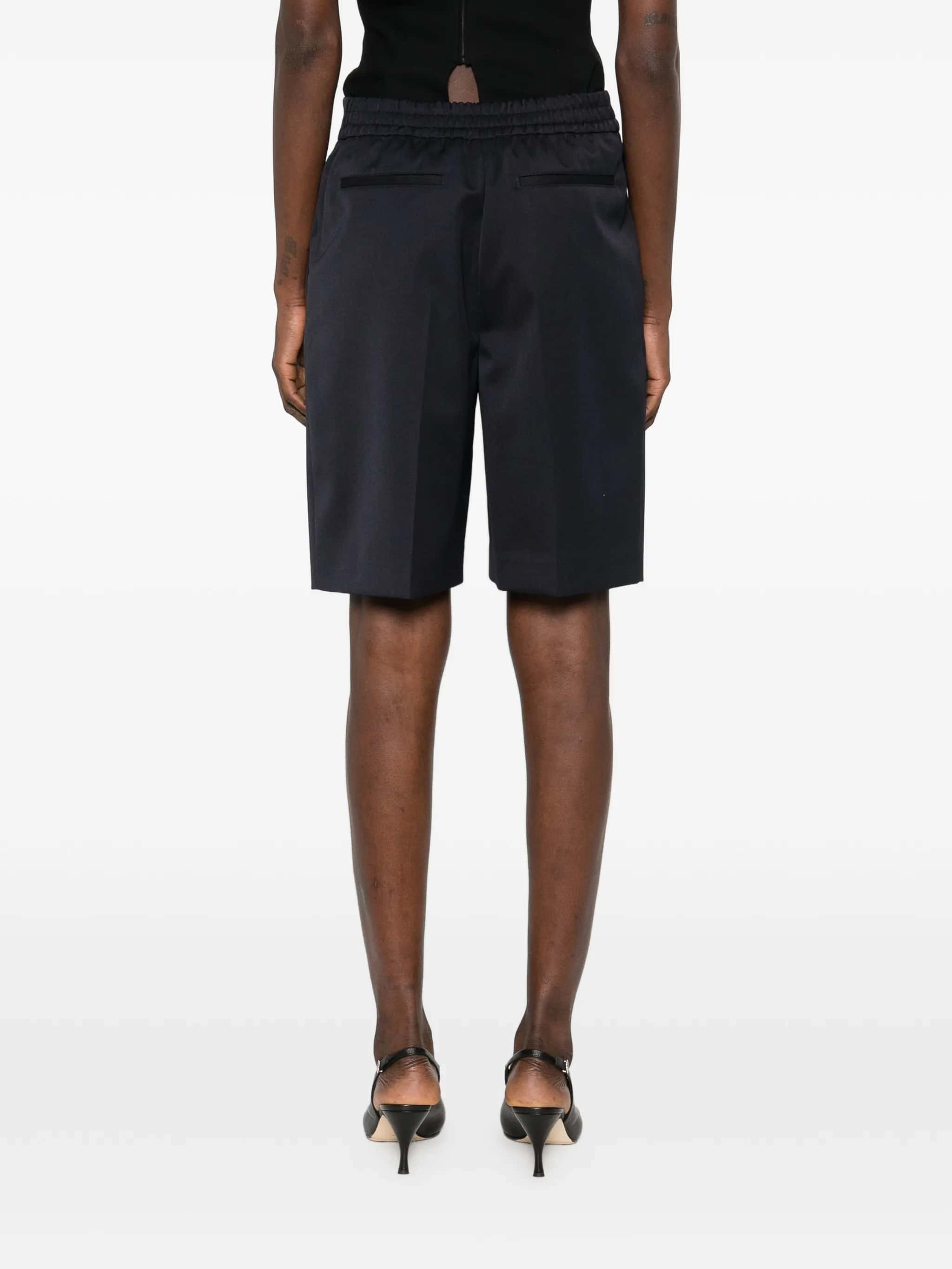 Shorts con pieghe frontali