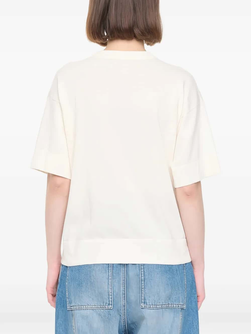 MAGLIA A MANICHE CORTE CON INTARSI FLOREALI BIANCHI